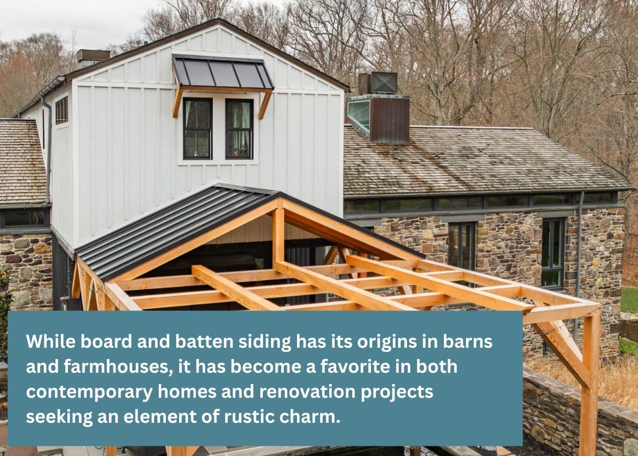 Board-and-batten siding on a home with a timber frame porch structure under construction.